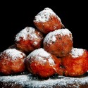 a lot of dutch food, named 'oliebollen' with suger